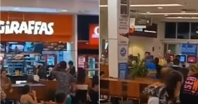 O jovem foi segurado por cerca de duas pessoas próximo a um restaurante no shopping