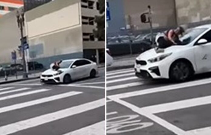 Para impossibilitar a ação, a mulher tentou parar um carro em alta velocidade